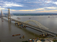 The steel deck pavement of the main channel bridge of the Changtai Yangtze River Bridge is under construction in Taixing, China, on July 21,...