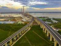 The steel deck pavement of the main channel bridge of the Changtai Yangtze River Bridge is under construction in Taixing, China, on July 21,...