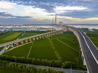 The steel deck pavement of the main channel bridge of the Changtai Yangtze River Bridge is under construction in Taixing, China, on July 21,...