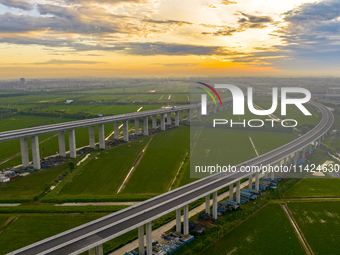 The steel deck pavement of the main channel bridge of the Changtai Yangtze River Bridge is under construction in Taixing, China, on July 21,...