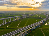 The steel deck pavement of the main channel bridge of the Changtai Yangtze River Bridge is under construction in Taixing, China, on July 21,...