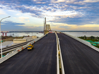 The steel deck pavement of the main channel bridge of the Changtai Yangtze River Bridge is under construction in Taixing, China, on July 21,...