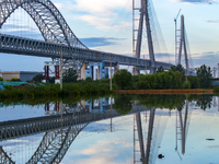 The steel deck pavement of the main channel bridge of the Changtai Yangtze River Bridge is under construction in Taixing, China, on July 21,...