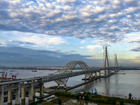 The steel deck pavement of the main channel bridge of the Changtai Yangtze River Bridge is under construction in Taixing, China, on July 21,...