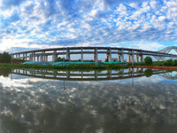 The steel deck pavement of the main channel bridge of the Changtai Yangtze River Bridge is under construction in Taixing, China, on July 21,...