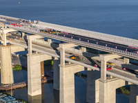 The steel deck pavement of the main channel bridge of the Changtai Yangtze River Bridge is under construction in Taixing, China, on July 21,...