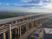 The steel deck pavement of the main channel bridge of the Changtai Yangtze River Bridge is under construction in Taixing, China, on July 21,...