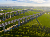 The steel deck pavement of the main channel bridge of the Changtai Yangtze River Bridge is under construction in Taixing, China, on July 21,...