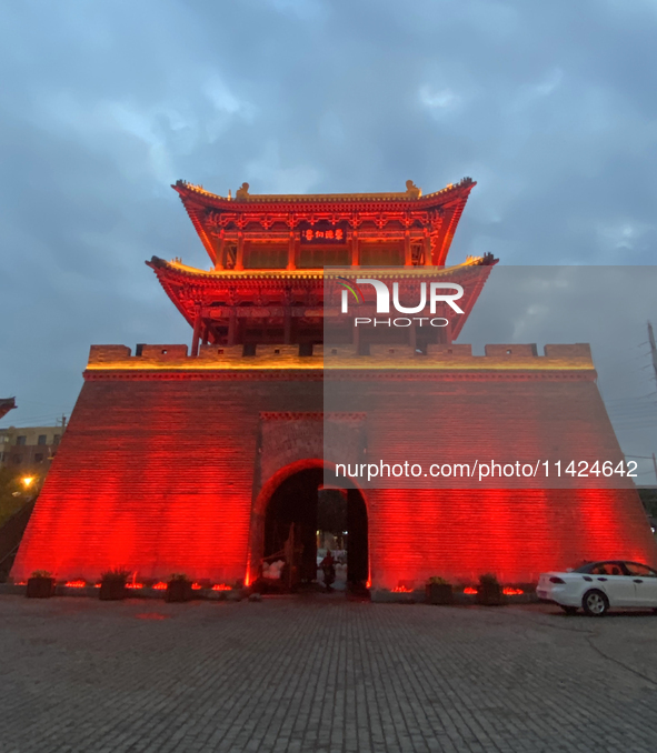 Tourists are enjoying the scenery of Saishang Old Street, the core area of the Saishang Old Street tourism and leisure district, in Hohhot,...