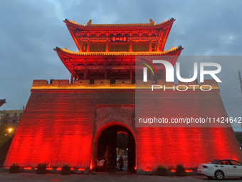 Tourists are enjoying the scenery of Saishang Old Street, the core area of the Saishang Old Street tourism and leisure district, in Hohhot,...