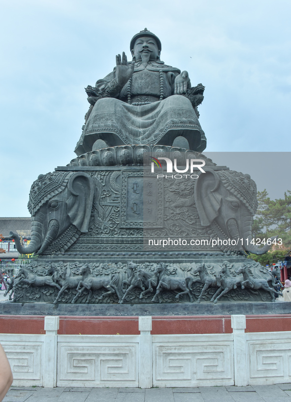 Tourists are enjoying the scenery of Saishang Old Street, the core area of the Saishang Old Street tourism and leisure district, in Hohhot,...