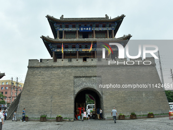 Tourists are enjoying the scenery of Saishang Old Street, the core area of the Saishang Old Street tourism and leisure district, in Hohhot,...