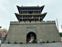 Tourists are enjoying the scenery of Saishang Old Street, the core area of the Saishang Old Street tourism and leisure district, in Hohhot,...