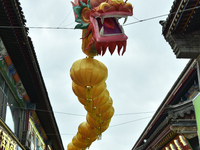 Tourists are enjoying the scenery of Saishang Old Street, the core area of the Saishang Old Street tourism and leisure district, in Hohhot,...