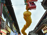 Tourists are enjoying the scenery of Saishang Old Street, the core area of the Saishang Old Street tourism and leisure district, in Hohhot,...