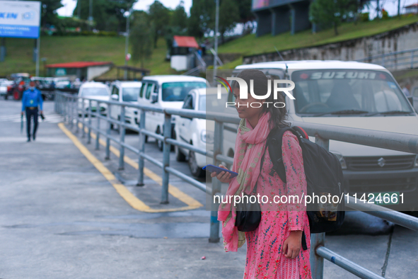 A Nepali student who is arriving back in Nepal from violence-hit Bangladesh is waiting for her relatives to pick her up from Tribhuvan Inter...