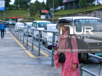 A Nepali student who is arriving back in Nepal from violence-hit Bangladesh is waiting for her relatives to pick her up from Tribhuvan Inter...