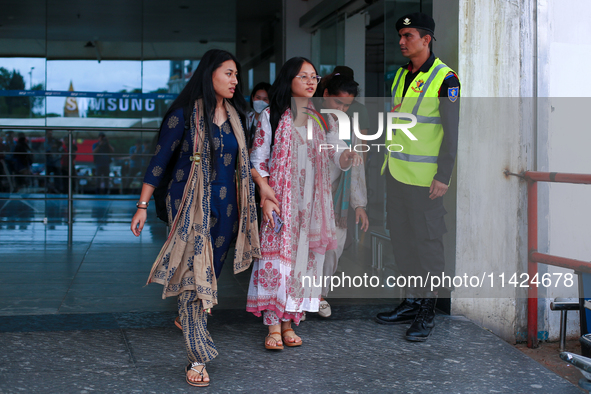 Krishpa Rai (center) along with other Nepali students are exiting the terminal of Tribhuvan International Airport upon arriving back in Kath...