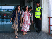 Krishpa Rai (center) along with other Nepali students are exiting the terminal of Tribhuvan International Airport upon arriving back in Kath...