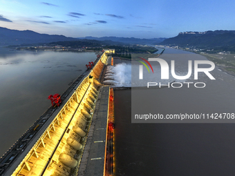 A spectacular view is showing the opening of the Three Gorges Dam to release floodwater in Yichang, Hubei province, China, on July 21, 2024....