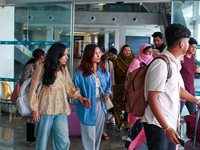 Nepali students are exiting the terminal of Tribhuvan International Airport upon arriving back in Kathmandu, Nepal, from violence-hit Bangla...