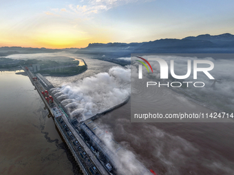 A spectacular view is showing the opening of the Three Gorges Dam to release floodwater in Yichang, Hubei province, China, on July 21, 2024....