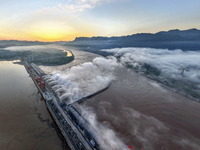 A spectacular view is showing the opening of the Three Gorges Dam to release floodwater in Yichang, Hubei province, China, on July 21, 2024....