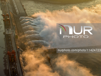 A spectacular view is showing the opening of the Three Gorges Dam to release floodwater in Yichang, Hubei province, China, on July 21, 2024....