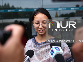 Sadikshya Basent, a Nepali student who is returning from violence-hit Bangladesh, is speaking to the media upon arriving at Tribhuvan Intern...