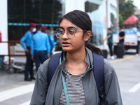 Sushmita Kumari, a Nepali student, is getting emotional while talking with her relatives upon arrival at Tribhuvan International Airport in...