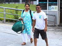 Nepali students are exiting the terminal of Tribhuvan International Airport upon arriving back in Kathmandu, Nepal, from violence-hit Bangla...