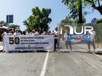 A group of Greek-Cypriots and Turkish-Cypriots is gathering at the Ledra Palace checkpoint to protest about the situation in Cyprus, demandi...