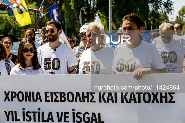 A group of Greek-Cypriots and Turkish-Cypriots is gathering at the Ledra Palace checkpoint to protest about the situation in Cyprus, demandi...