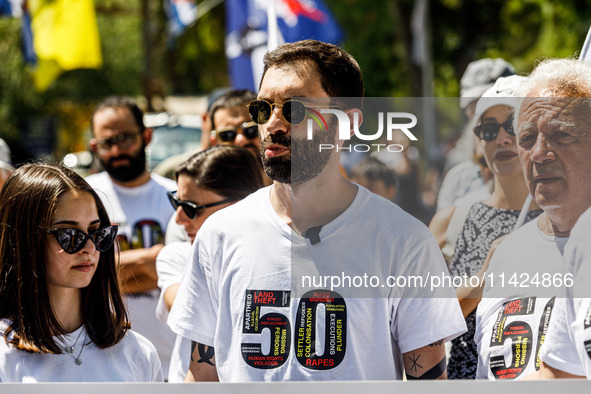 A group of Greek-Cypriots and Turkish-Cypriots is gathering at the Ledra Palace checkpoint to protest about the situation in Cyprus, demandi...