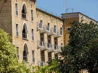 Bullet holes are still visible on the building of the former luxury Ledra Palace hotel inside the buffer zone, which is now being used by th...