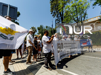 A group of Greek-Cypriots and Turkish-Cypriots is gathering at the Ledra Palace checkpoint to protest about the situation in Cyprus, demandi...