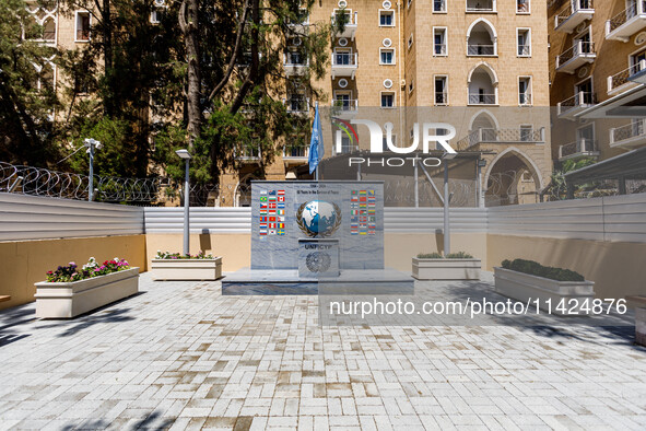 A monument for the 60 years of UNFICYP service in Cyprus is being seen in front of the Ledra Palace hotel in Nicosia, Cyprus, on July 20, 20...