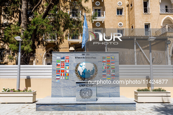 A monument for the 60 years of UNFICYP service in Cyprus is being seen in front of the Ledra Palace hotel in Nicosia, Cyprus, on July 20, 20...