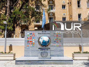 A monument for the 60 years of UNFICYP service in Cyprus is being seen in front of the Ledra Palace hotel in Nicosia, Cyprus, on July 20, 20...