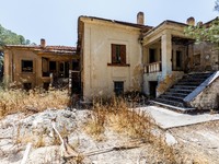 An abandoned house that is being used as a defensive point during the 1974 war is seen near Ledra Palace checkpoint in Nicosia, Cyprus, on J...