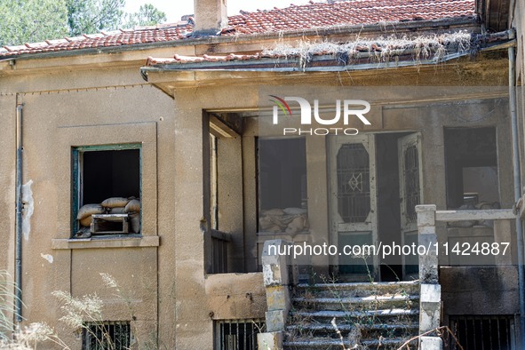 An abandoned house that is being used as a defensive point during the 1974 war is seen near Ledra Palace checkpoint in Nicosia, Cyprus, on J...