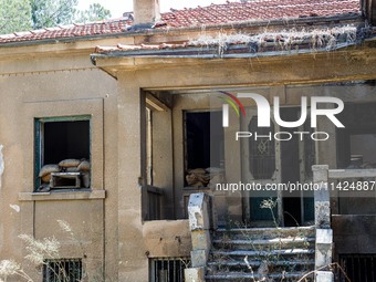 An abandoned house that is being used as a defensive point during the 1974 war is seen near Ledra Palace checkpoint in Nicosia, Cyprus, on J...