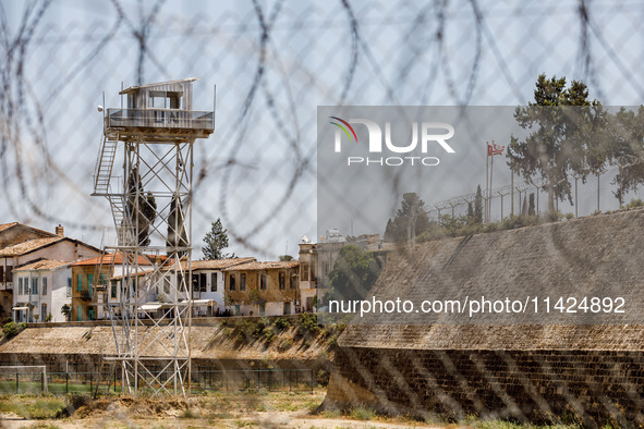 A UN outpost is being seen inside the buffer zone with the flags of Turkey and the self-declared ''Turkish Republic of Northern Cyprus'' vis...