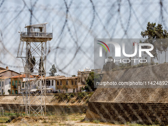 A UN outpost is being seen inside the buffer zone with the flags of Turkey and the self-declared ''Turkish Republic of Northern Cyprus'' vis...