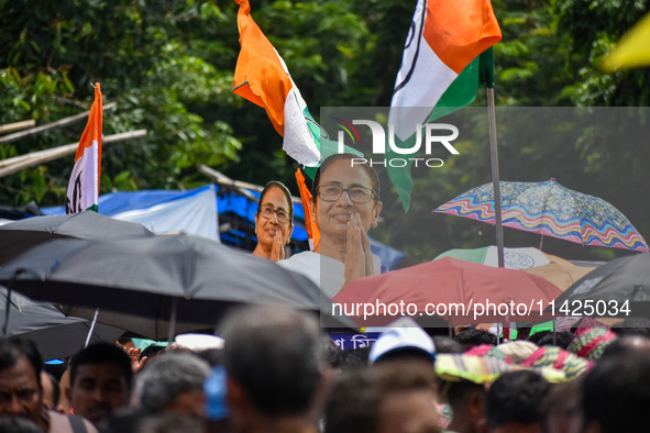 A large cutout of TMC supremo CM Mamata Banerjee is being seen at the annual martyrs' day rally held by the TMC party in Kolkata, India, on...