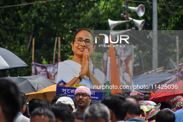 A large cutout of TMC supremo CM Mamata Banerjee is being seen at the annual martyrs' day rally held by the TMC party in Kolkata, India, on...