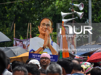 A large cutout of TMC supremo CM Mamata Banerjee is being seen at the annual martyrs' day rally held by the TMC party in Kolkata, India, on...