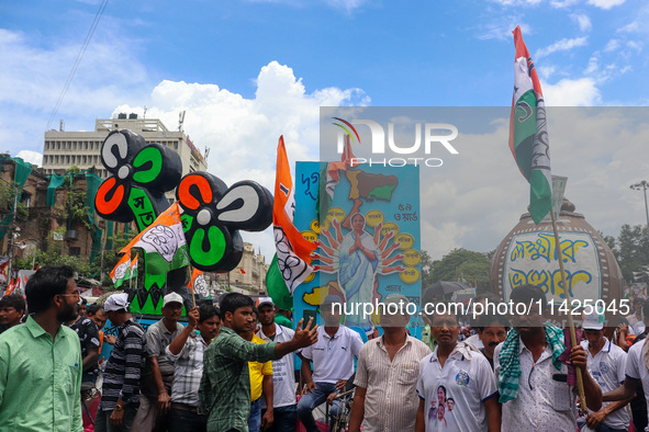 People are attending the annual Martyrs' Day rally held by the TMC party in Kolkata, India, on July 21, 2024. 