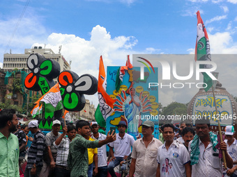 People are attending the annual Martyrs' Day rally held by the TMC party in Kolkata, India, on July 21, 2024. (