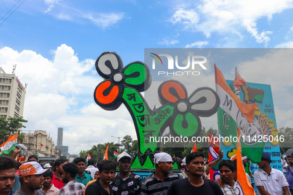 A large cutout of the TMC emblem is being seen during the annual martyrs' day rally held by the TMC party in Kolkata, India, on July 21, 202...